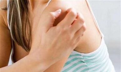 the girl scratching her shoulder